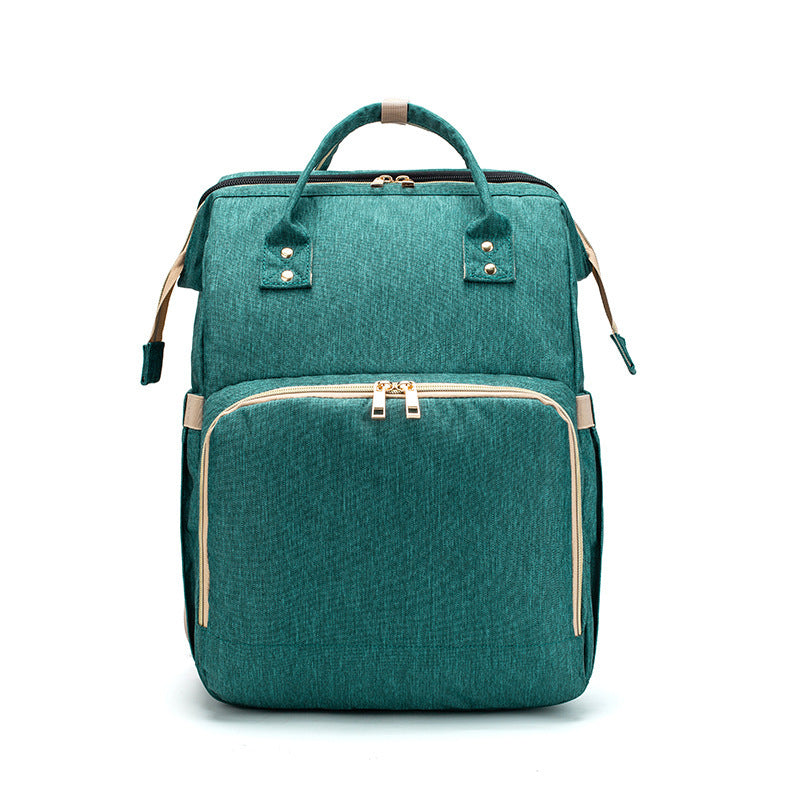 Portable Baby Haven: Diaper Bag Backpack with Built-In Bed & Charging Port!
